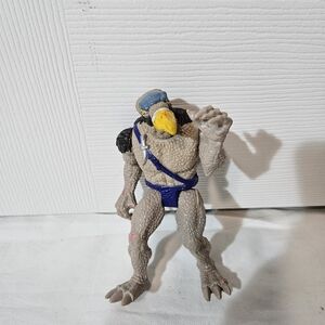 Vintage Action Figure with Blue and Yellow Accents